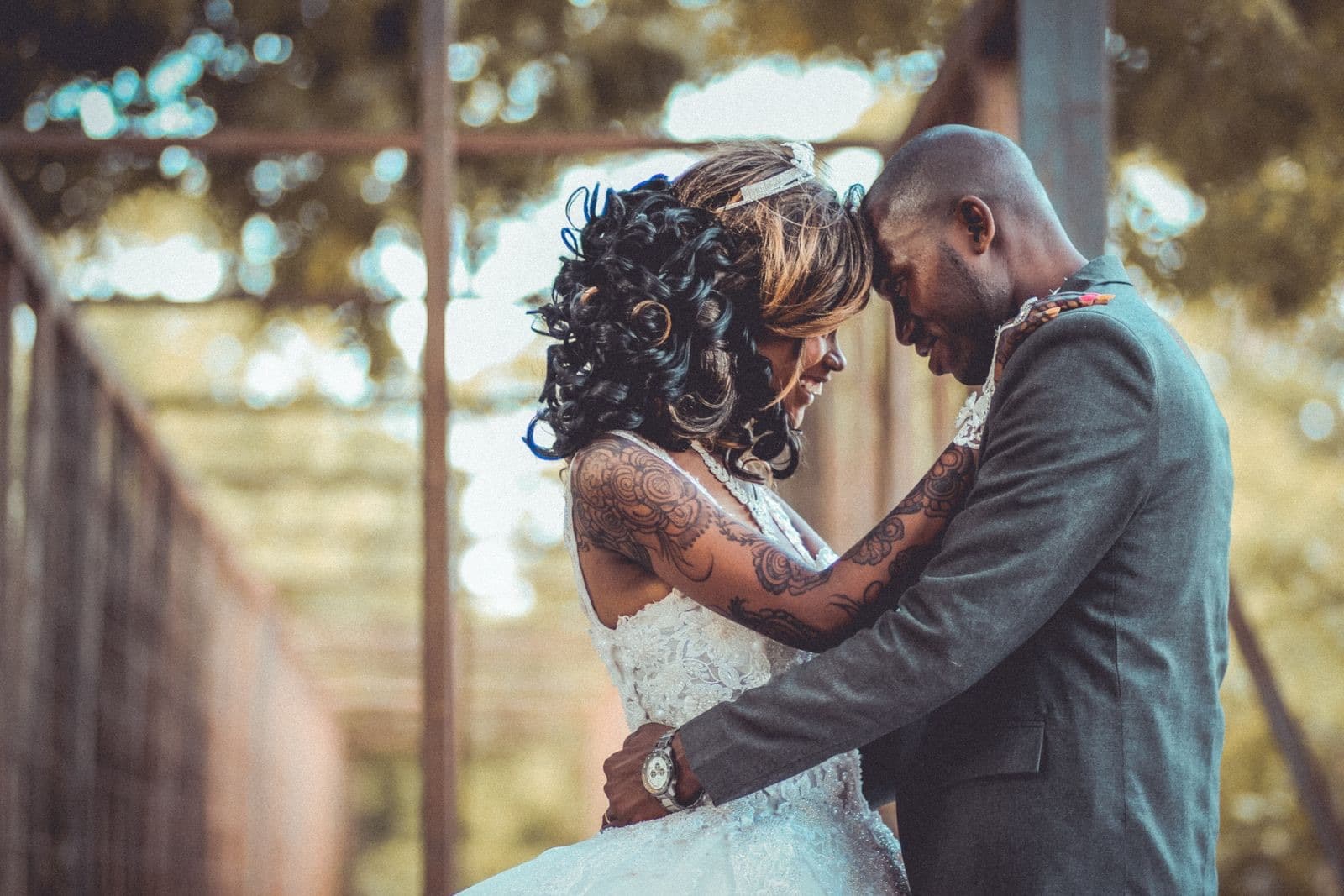 A couple touching foreheads in a garden